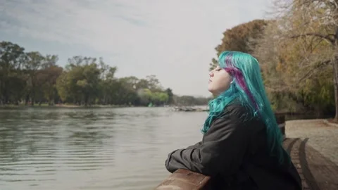 Dolly forward shot of a lovely plus size woman looking to the lake Stock-Footage 139365217