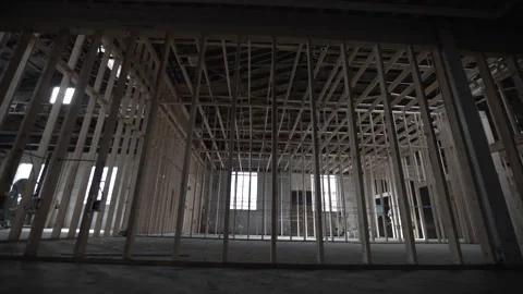 Dolly Left Right Shot Extensive Wood Framing Open Construction Site Interior Vidéo 336325789