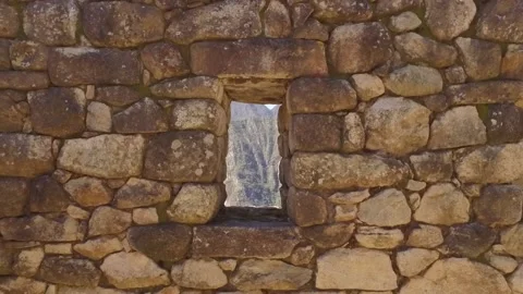 Dolly in Looking at mountains through stone window. Machu Picchu, Cusco, Peru Stock Footage 130461721