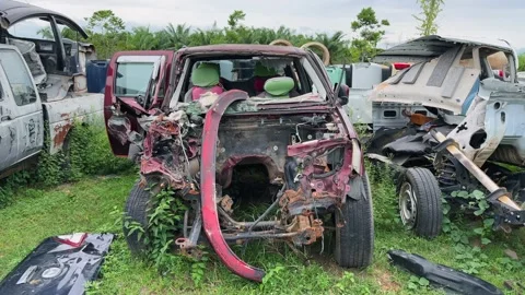 Dolly in motion to Crashed and Dismantled SUV Reflecting Road Safety Crisis and Stock Footage 314354307