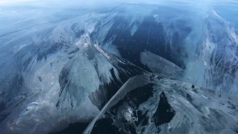Dolly motion macro blue ice Lake Baikal deep cracks depth winter frozen nature Video stock 165663922