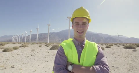 Dolly move around happy wind farm technician looking confident 4K Stock Footage 63777278