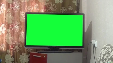 Dolly Move Into a Big Screen TV With Greenscreen Stock Footage 75913565