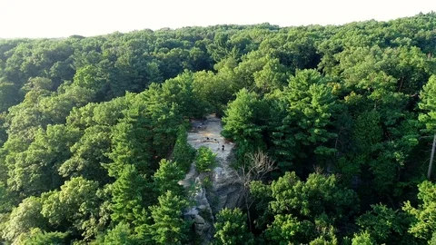 Dolly out aerial shot of tiny viewpoint and a beautiful, thick forest Video stock 109794043
