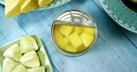 Dolly in/out on a can of pineapple chunks Stock Footage 61535323