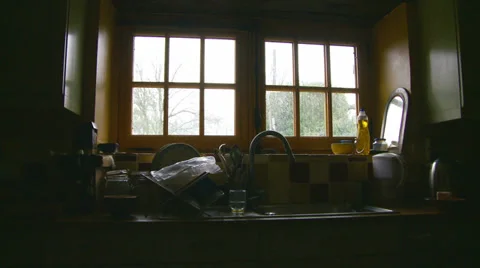 Dolly out cottage kitchen window Stock Footage 37374948