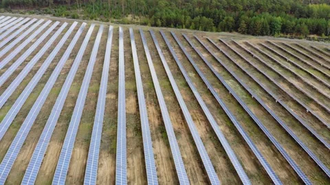 Dolly out flyover solar panel field with drone Stock Footage 138754161