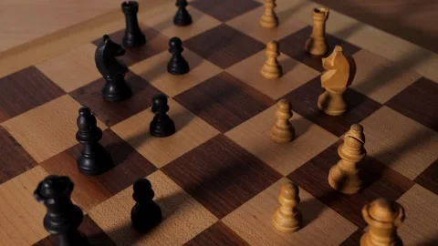 Dolly over a chessboard with pieces lined up for battle Stock Footage 250168628