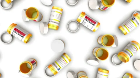 Dolly over the top of many Empty Pill Bottles Stock Footage 39884813