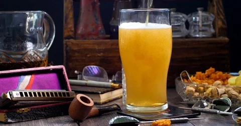 Dolly panning view of a cold pint of beer (lager) being poured in a pub Stock Footage 76448490