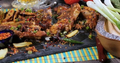 Dolly panning view of delicious braised sticky king pork ribs Stock Footage 77564298