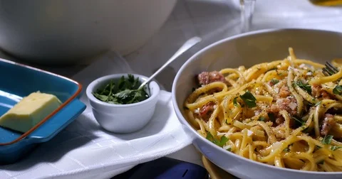 Dolly panning view of a delicious plate of spaghetti carbonara Stock Footage 72620569