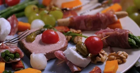 Dolly panning view of a platter of cured meat (charcuterie) Stock Footage 72177669