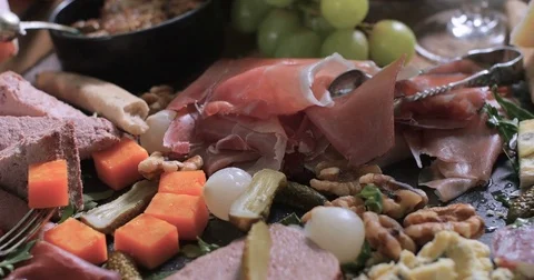 Dolly panning view of a platter of cured meat (charcuterie) Stock Footage 75000465