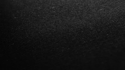 Dolly panorama on black and gray factory fabric. Macro shot. Stock Footage 254131344