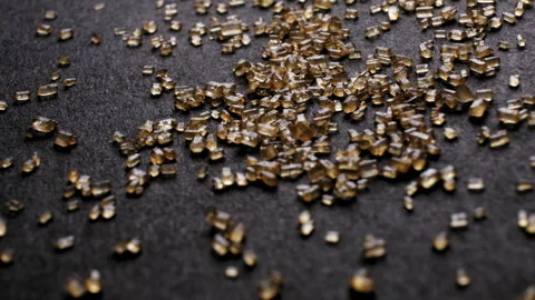 Dolly panorama of brown cane sugar on black background Stock Footage 254133535