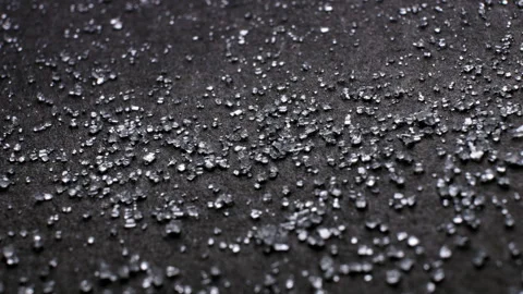 Dolly panorama of white sugar similar to diamond crystals on a black background Stock Footage 254106934