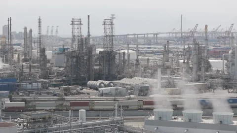 Dolly past the smoke stack with the port of los angeles in the back ground Stock Footage 290821579