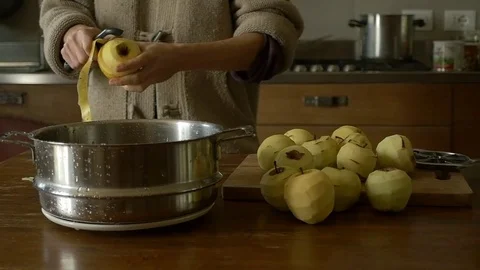 Dolly peeling apple in the kitchen Stock Footage 70872157