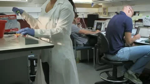 Dolly of people working in a lab Stock Footage 10680955
