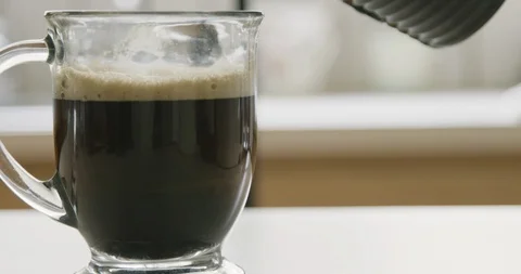 Dolly pouring milk into the coffee Stock Footage 89715488