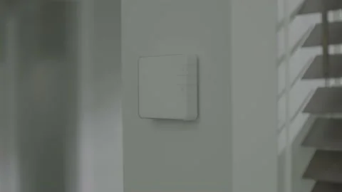 Dolly pull out of security controller in house Stock Footage 149132567