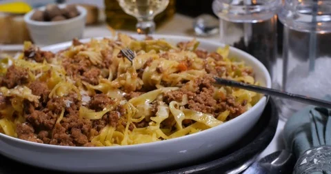 Dolly push in close up view of delicious steamy fettuccine in bolognese sauce Stock Footage 75004244