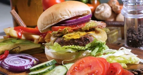 Dolly push in view of a delicious cheeseburger Stock Footage 73737635