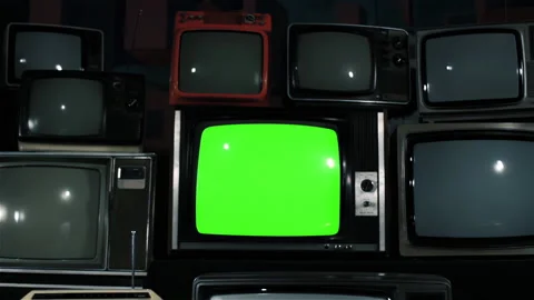 Dolly In On Retro CRT Television Stack With Iron Tone And Green Screen - 4K Stock Footage 339607533