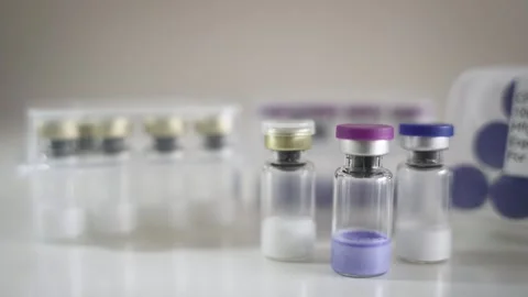 Dolly Right Across Pharmaceutical Vials and Research Use Only Case [Peptide Stock Footage 336204138