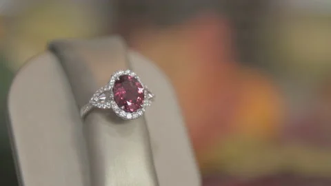 Dolly right Close up of Diamond Ring with large Rose Stone in middle Stock Footage 130670950