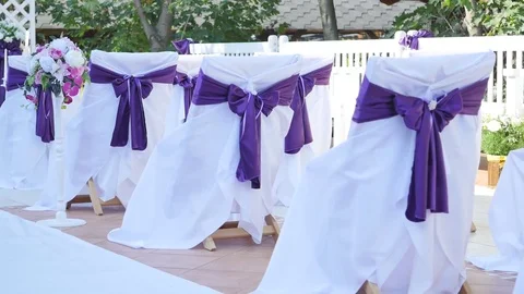 Dolly of rows of chairs at a wedding ceremony 動画素材 83127132