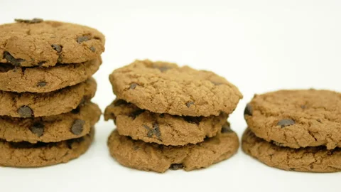 Dolly of rows chocolate chip cookies on white background Stock Footage 162238747