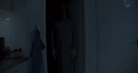 Dolly in of scary demon standing at the edge of dark room 스톡 동영상 146051468