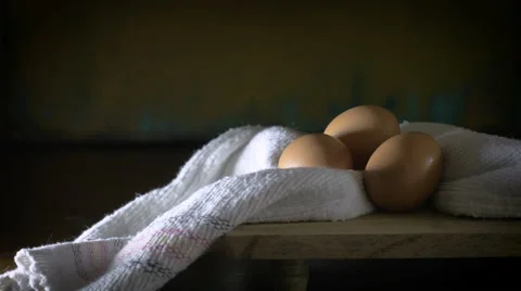 Dolly shot of 3 eggs resembling a renaissance still life paiting Video stock 57533403