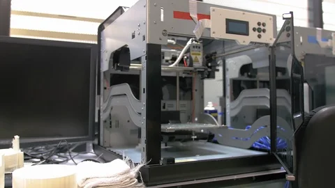 Dolly in shot of a 3D printer on a desk reveals its internal components Stock-Footage 108965213