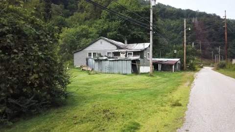 Dolly shot of abandoned coal mining town in the Appalachian mountains of West Stock Footage 158932058