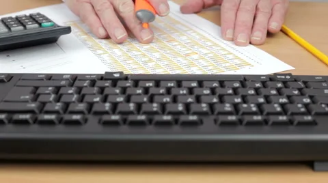 Dolly shot of an accountant using a calculator Stock Footage 63151696