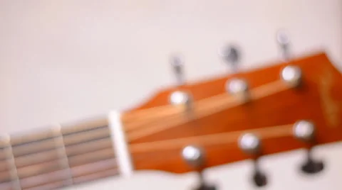 Dolly Shot and Rack Focus of Fretboard of Acoustic Guitar Stock Footage 35331968