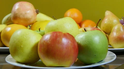 Dolly shot from apples, over pears, to grapes, fresh fruits close up Stock Footage 60374842