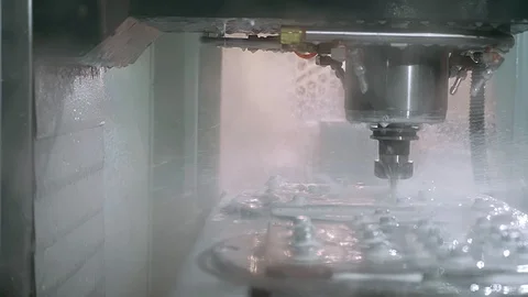 Dolly shot of automatic cut sheet metal mechanism with liquid cooling and water Video stock 101745487
