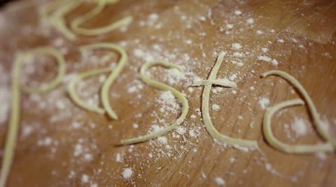 Dolly shot of blurring script of pasta. Video stock 35794879