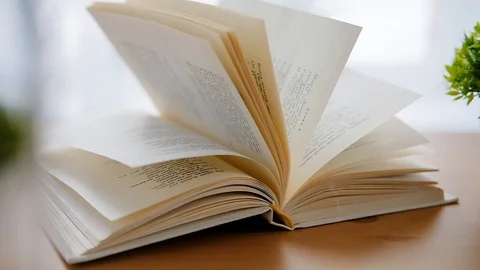 Dolly shot of a book on the table. Stock Footage 124730101