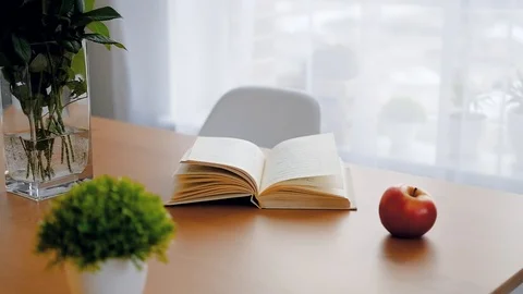 Dolly shot of a book on the table. Stock Footage 124730285