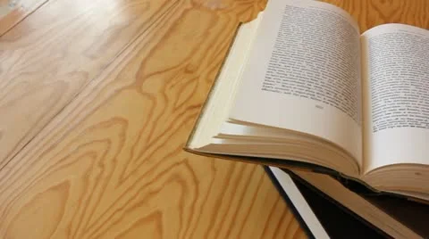 Dolly shot of books on table Stockbeeldmateriaal 11867622