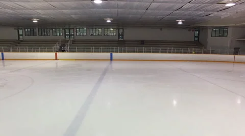 Dolly shot of Canadian Ice Rink interior - empty stands Stock Footage