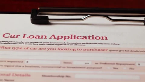 Dolly shot of car loan application important form document on table 2 Stock Footage 266084074