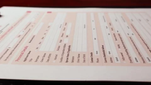Dolly shot of car loan application important form document on table Stock Footage 266084084