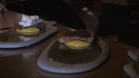 Dolly shot of a chef assembling three desserts Stock Footage 58786999