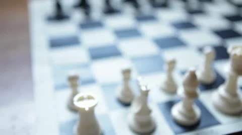 Dolly shot of chess board with focus on pawn piece Stock Footage 20535577